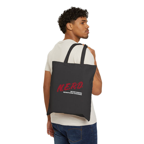 black tote bag with red design that says nerd on a model