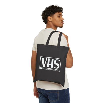 black tote bag featuring VHS analog wealth design in white