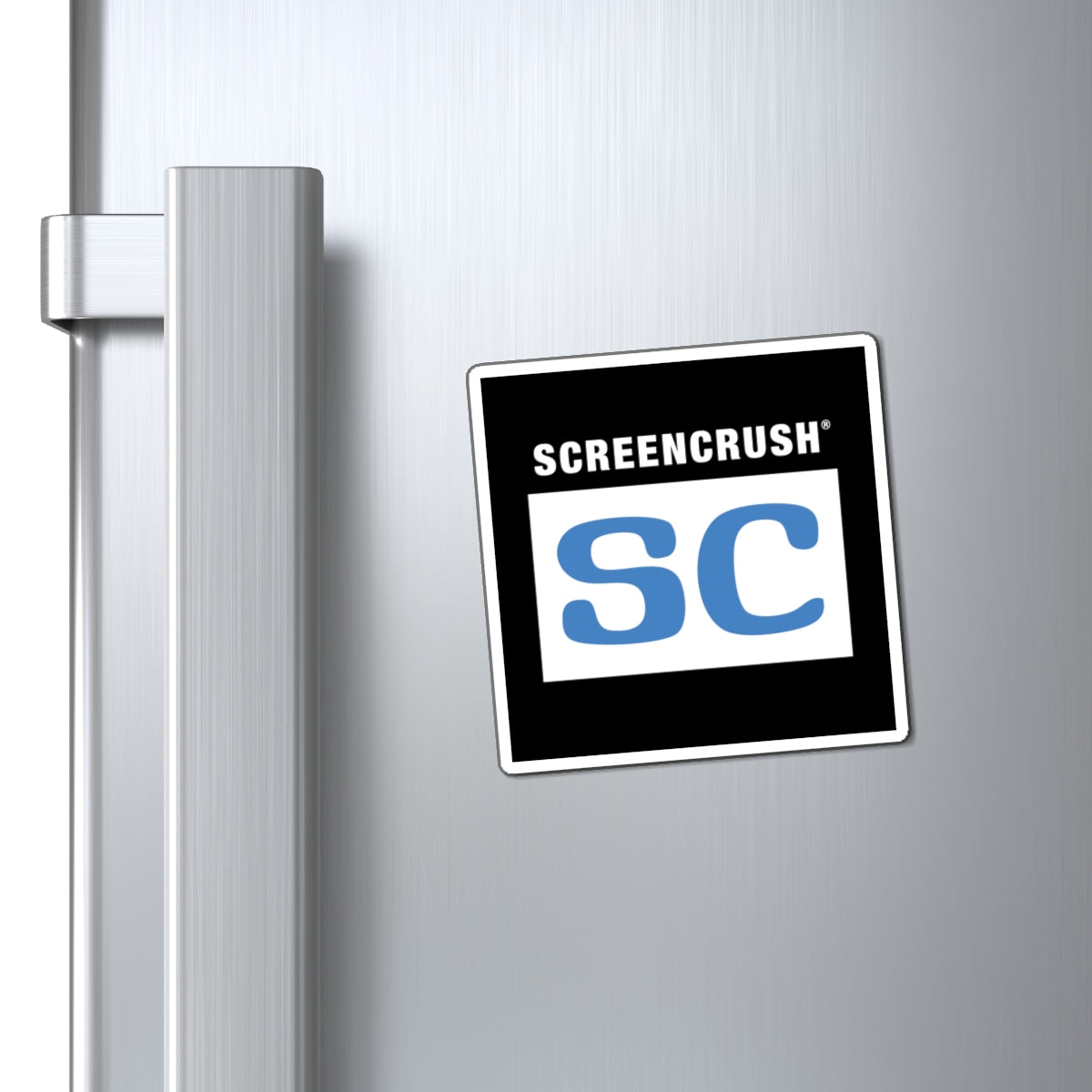 Black magnet outlined in white with white box containing blue SC rating shown on fridge